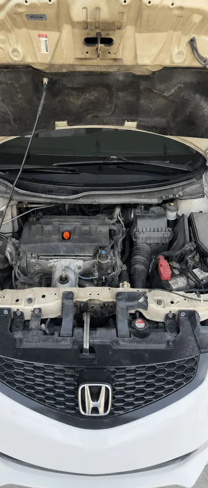 Before: Honda Civic engine bay coated in dust and grime
