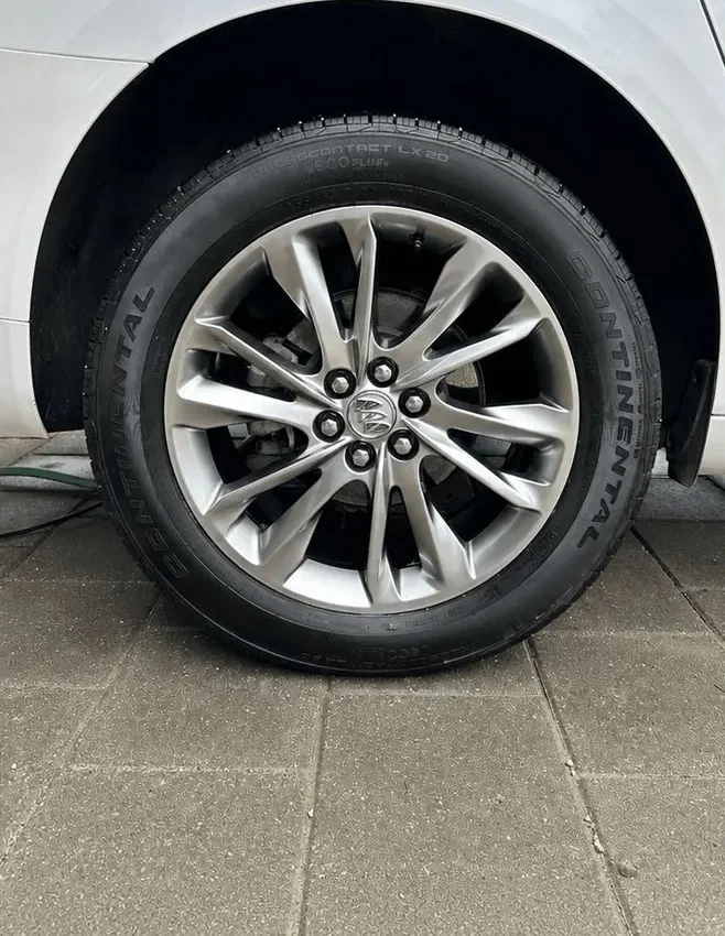 After an exterior detail: clean wheel and a dressed, deep-black tire