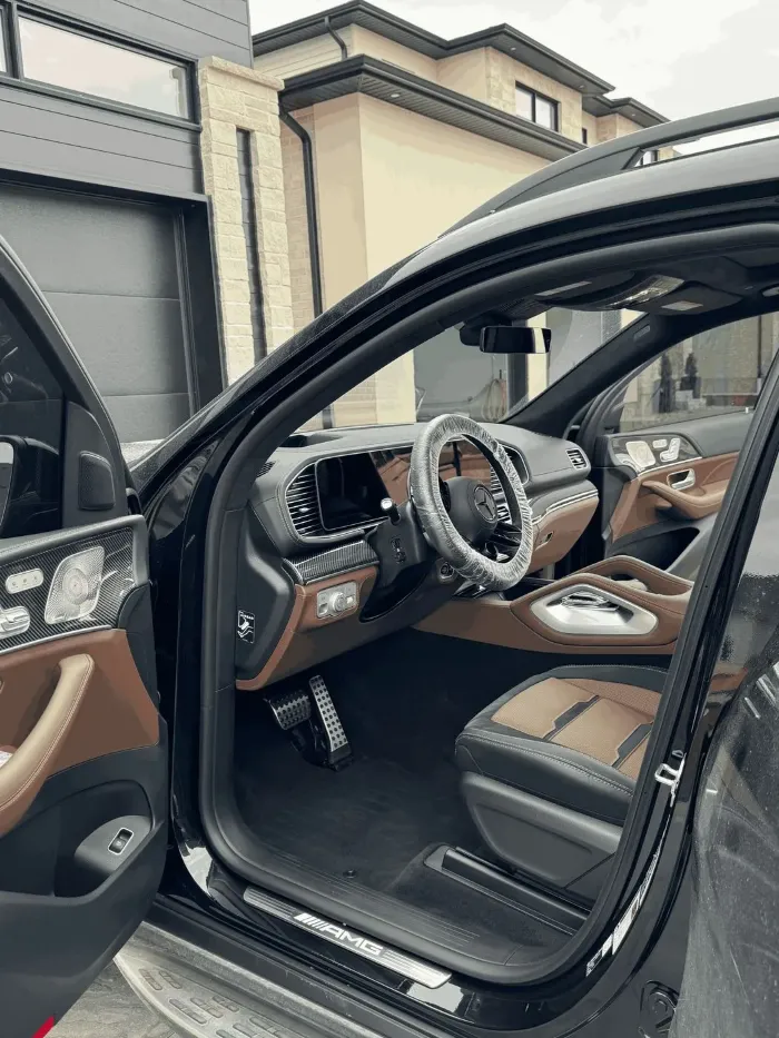 Mercedes-AMG interior with clean leather seats and door panels after a detail