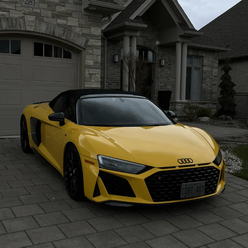 Yellow Audi R8 Spyder after an exterior detail in a London, ON driveway